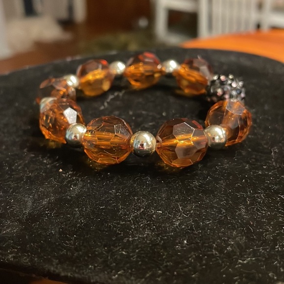 8” stackable stretch bracelet with 8 amber color & 9 silver tone beads - Picture 4 of 13
